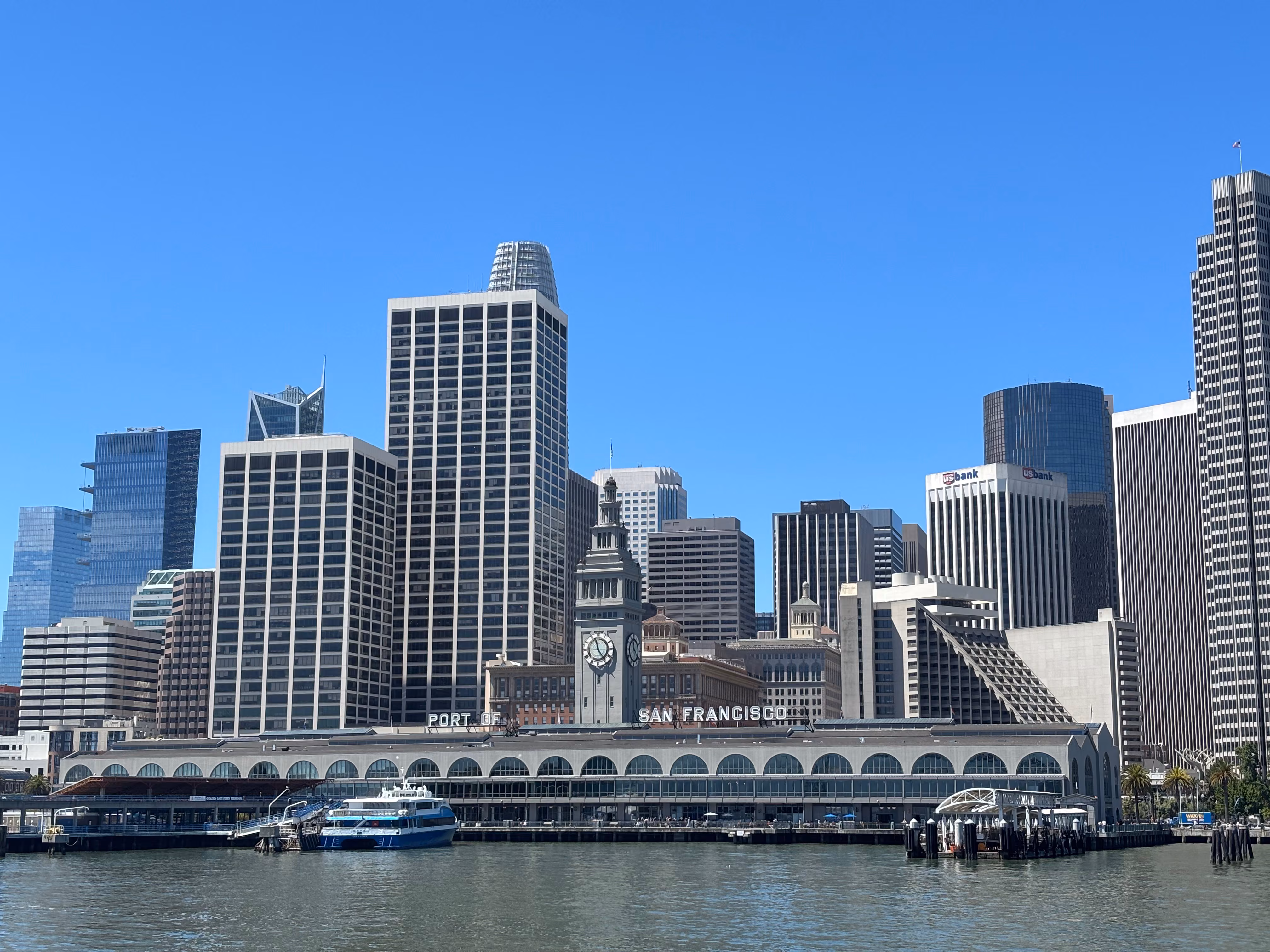The San Francisco Ferry Building and downtown skyline seen from the ferry